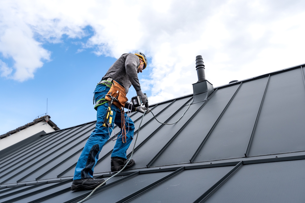 working man fixing a roof 